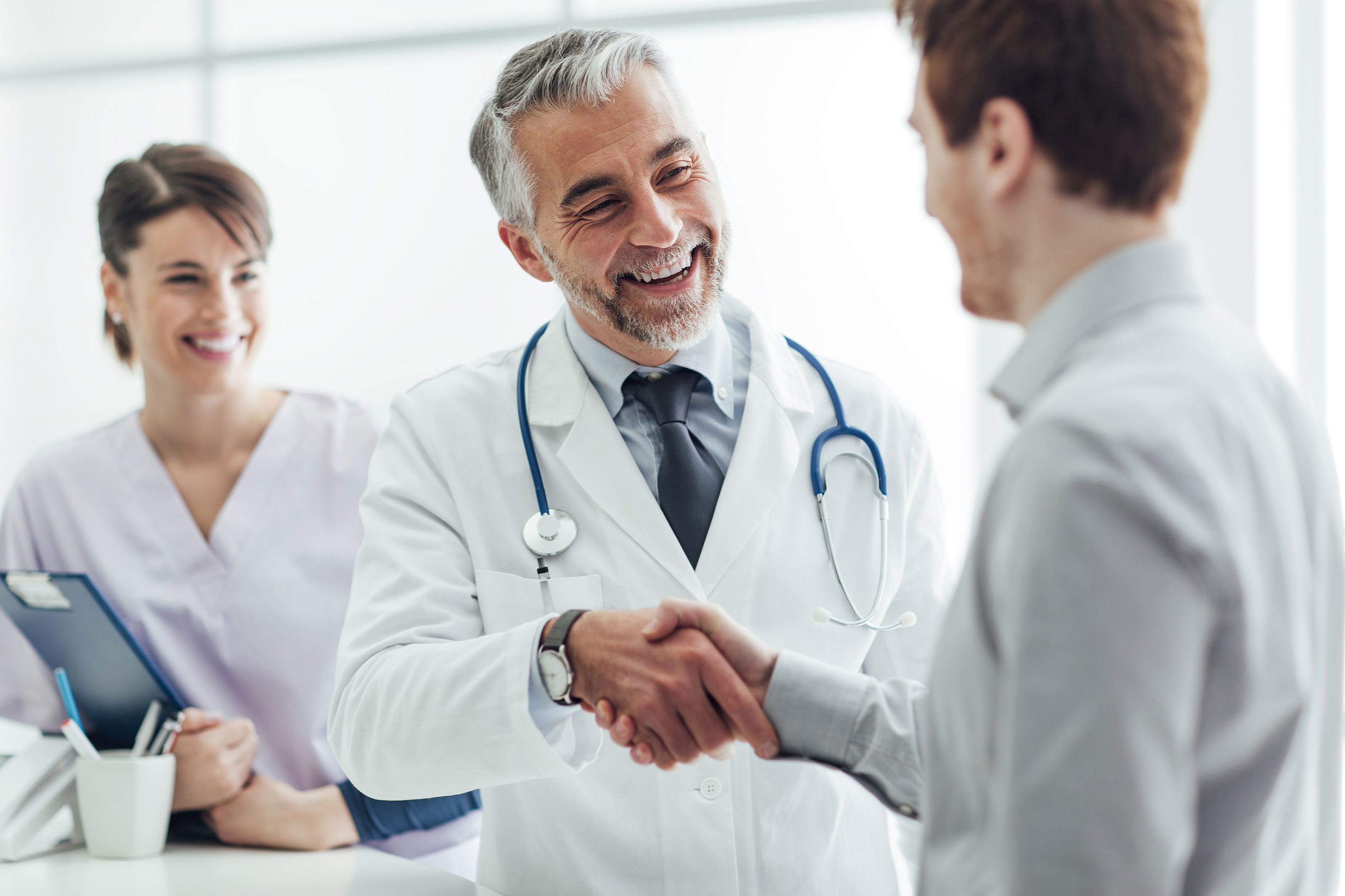 doctor shaking hands with applicant